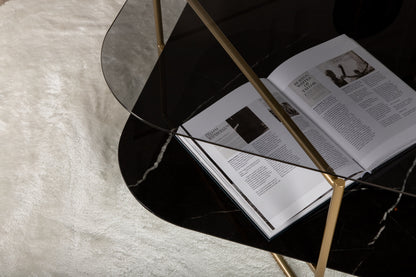 un-line Sofatisch aus Glas und Stahl in Schwarz/Gold