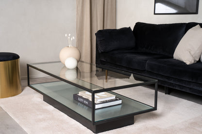 Couchtisch Maglehem aus Glas mit schwarzem Metallrahmen